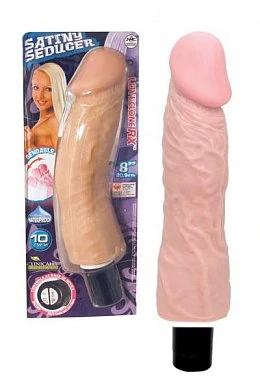 Вибромассажер телесного цвета.