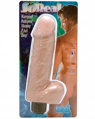 Большой каучуковый вибратор, выполненный в виде реалистичного фаллоса с мошонкой. 